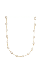 Delicate station necklace featuring freshwater-inspired pearls evenly spaced along a fine chain.
