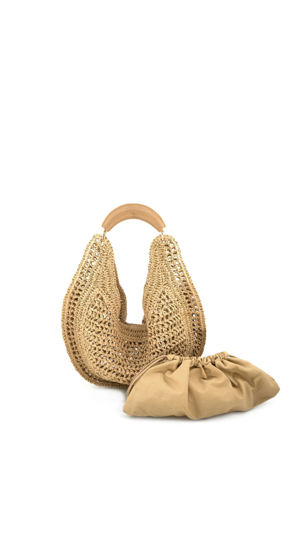 Woven shoulder bag with open knit design and removable drawstring pouch insert.
