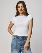 Model wearing a fitted short-sleeve knit tee with a crew neckline, styled with relaxed drawstring pants.