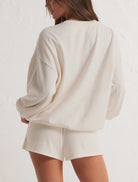 Z Supply Oversized Vacay Sweatshirt White. Planning a vacay? Grab the Oversized Vacay Sweatshirt and stay comfy on your flight or road trip. This classic crew pullover is also perfect for staycations or lounging around the house. Throw it on over denim and this top easily creates a comfy casual look.