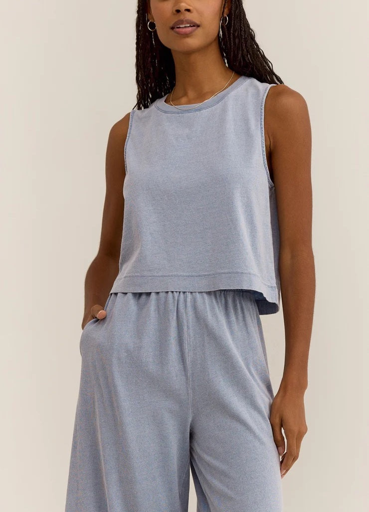 Z Supply Sloane Jersey Denim Muscle Tank Washed Indigo. This knit tank has the denim look you love but with a lightweight, soft feel and hint of stretch. This style will elevate your casual look instantly!