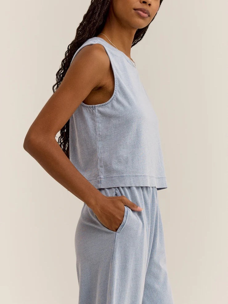 Z Supply Sloane Jersey Denim Muscle Tank Washed Indigo. This knit tank has the denim look you love but with a lightweight, soft feel and hint of stretch. This style will elevate your casual look instantly!
