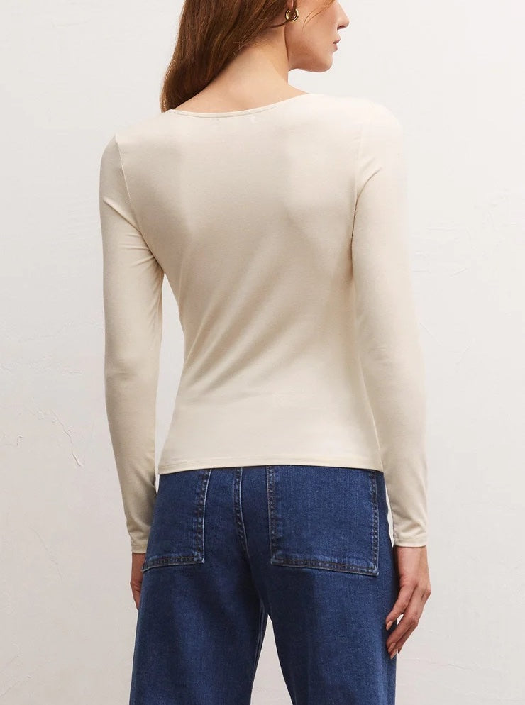 Z Supply Mara Knotted Top Sand Stone. Made using rayon spandex knit fabric, this body skimming top makes a perfect going-out look with a faux leather skirt or distressed jeans, Note, the sandstone color is semi-sheer.