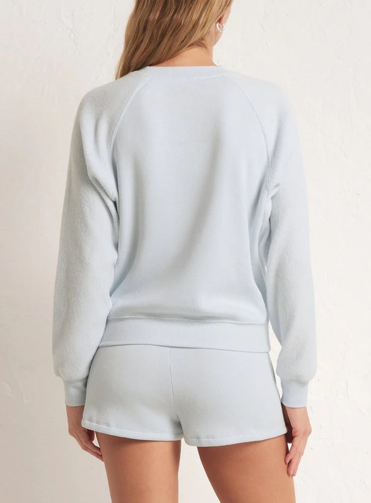 Z Supply Saldana Reverse Fleece Top Pool Blue. Prepare to get cozy in the Saldana Reverse Fleece Top. This reverse textured pullover is soft and comfy, making it an easy choice, day after day.