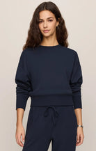 Relaxed crewneck sweatshirt with dropped shoulders, long sleeves, and ribbed trim.