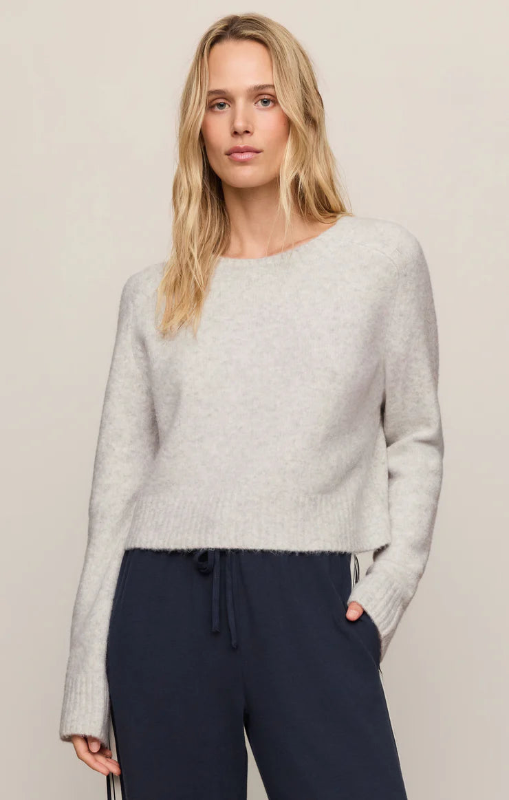 Relaxed crewneck sweater with long sleeves, cropped fit, and ribbed trim.
