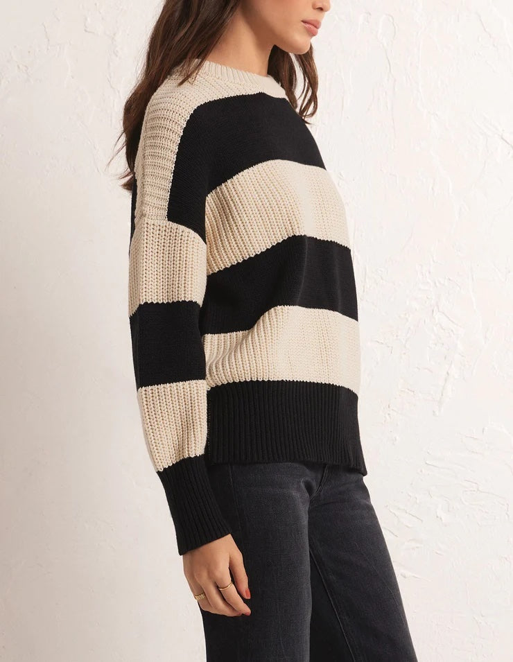 Z Supply Fresca Stripe Sweater Black Beige. The Fresca Stripe Sweater features a timeless wide yarn dye stripe design. Wear it tucked or untucked, this pullover is a versatile statement style you'll enjoy wearing year-round