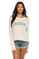 Lightweight crewneck sweater with relaxed fit and coastal graphic detail styled with denim shorts