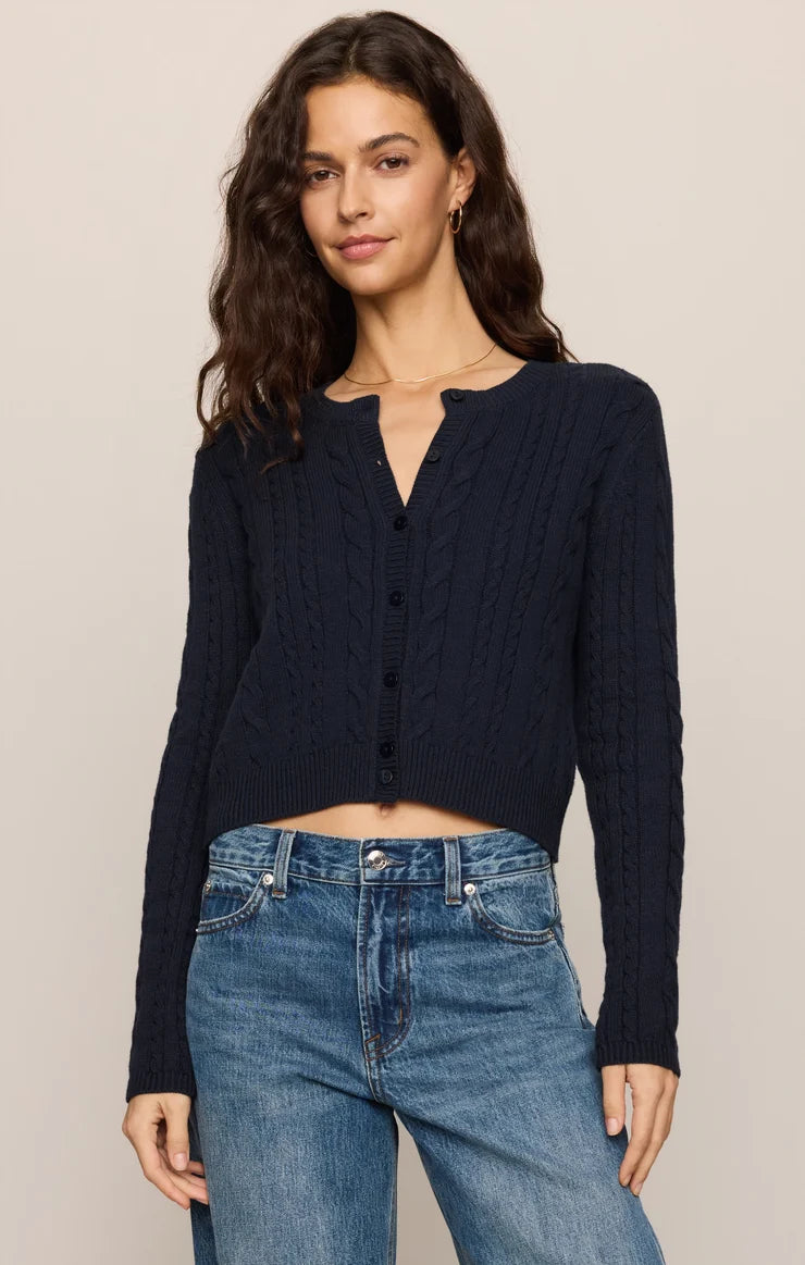 Cable-knit button-front cardigan with long sleeves, cropped fit, and ribbed trim.