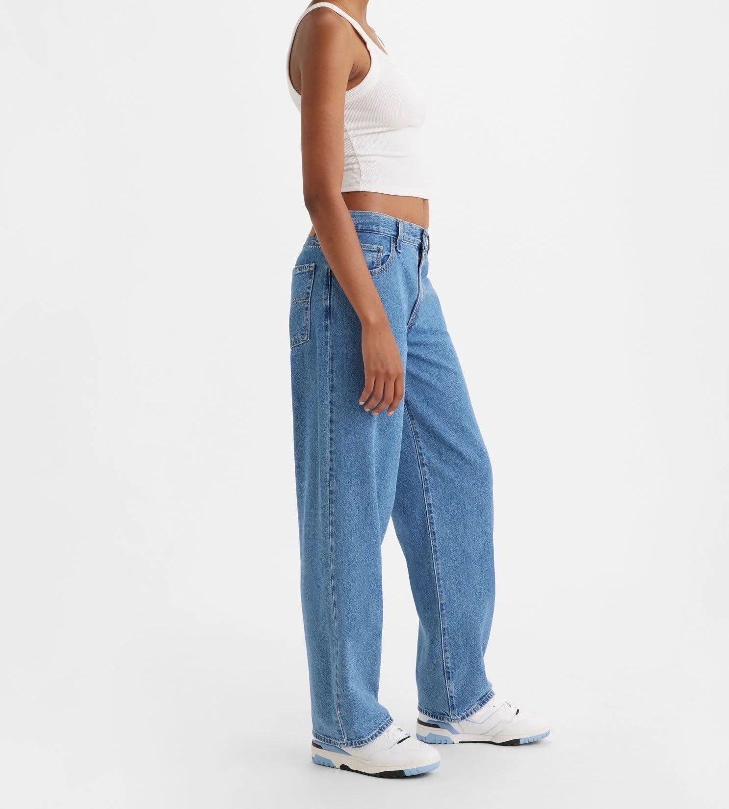 Levi Baggy Dad Jean Medium Blue Wash. The kind of jean you might steal from your dad's closet but baggier. With a mid rise and straight leg, this pair is relaxed yet flattering with extra room for a subtle edge.