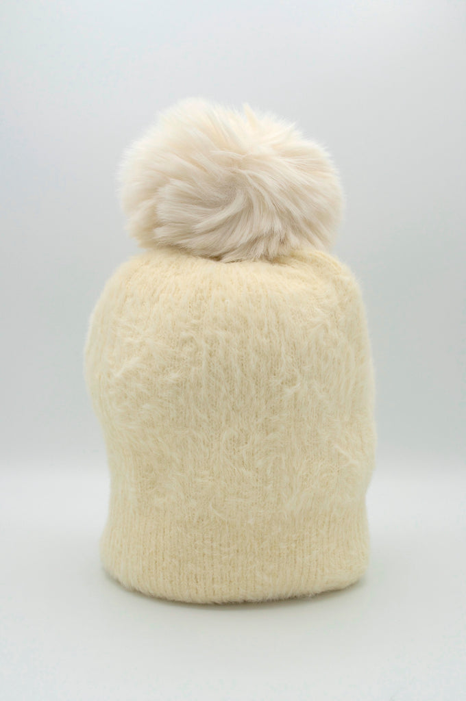 Classic Fuzzy Pom Beanie White. This fuzzy beanie features a soft fuzzy fabric with a pom-pom on top, perfect for wearing everyday in the colder months.