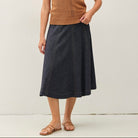 Be Cool Lightweight Flowy Midi Skirt with Elastic Waistline in Black, front view