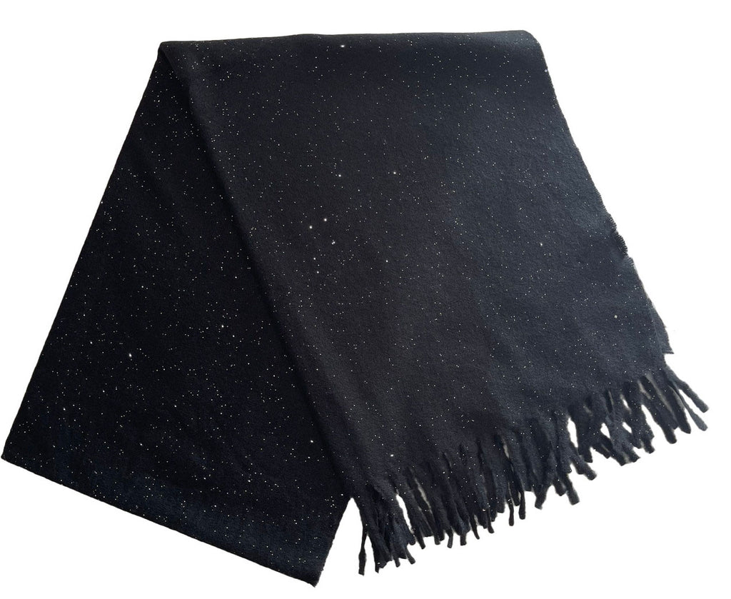 Sparkle Scarf Black. This soft scarf features subtle sparkle throughout and fringe ends, perfect for adding a little extra glam to any outfit day or night.