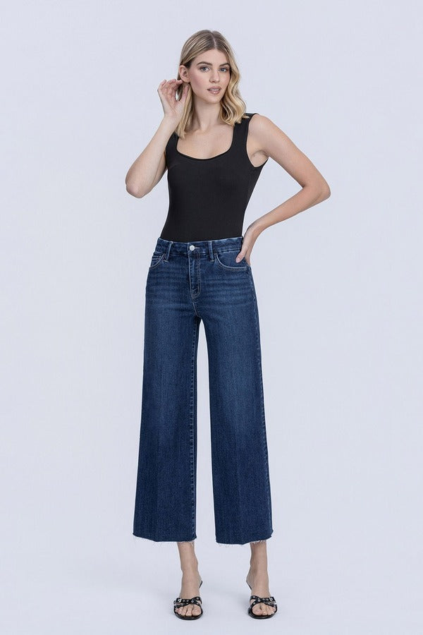 Flying Monkey High Rise Crease Line Trouser Wide Leg Jean in Caring, front view with hands on hips