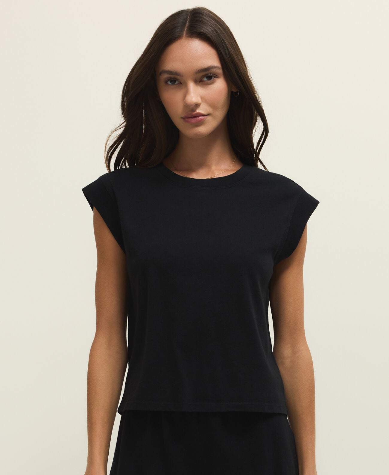 women muscle tee top, relaxed muscle tee women, casual everyday top women, elevated basic top, soft jersey sleeveless top, modern minimal tee women, easy layering top women, casual summer basics, effortless everyday outfit top, capsule wardrobe essentials women