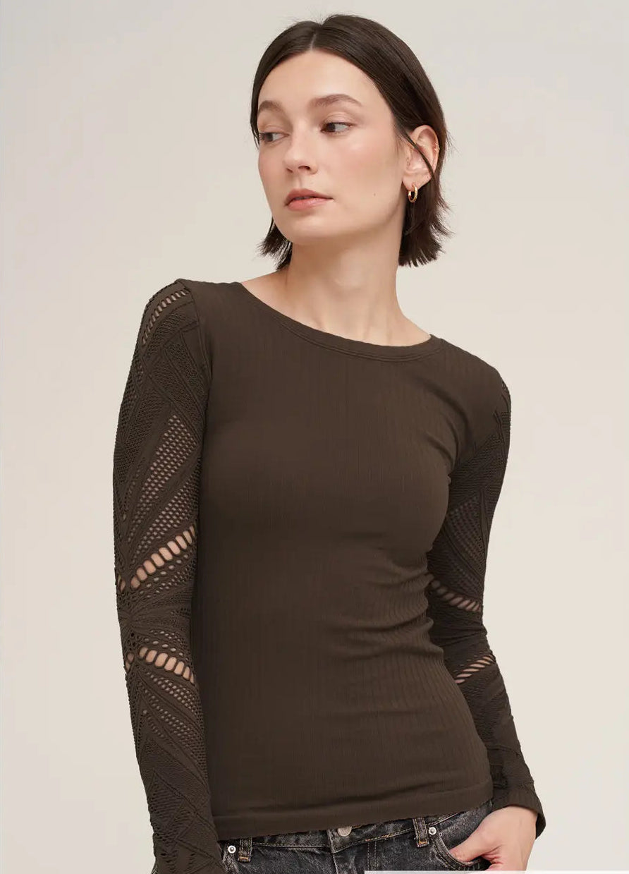 A woman wearing a dark brown long-sleeve ribbed knit top with open-knit lace sleeves, paired with dark jeans. A text overlay at the bottom right reads '2274 CHOCOLATE'.