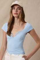 sweetheart neckline cap sleeve top with lace trim