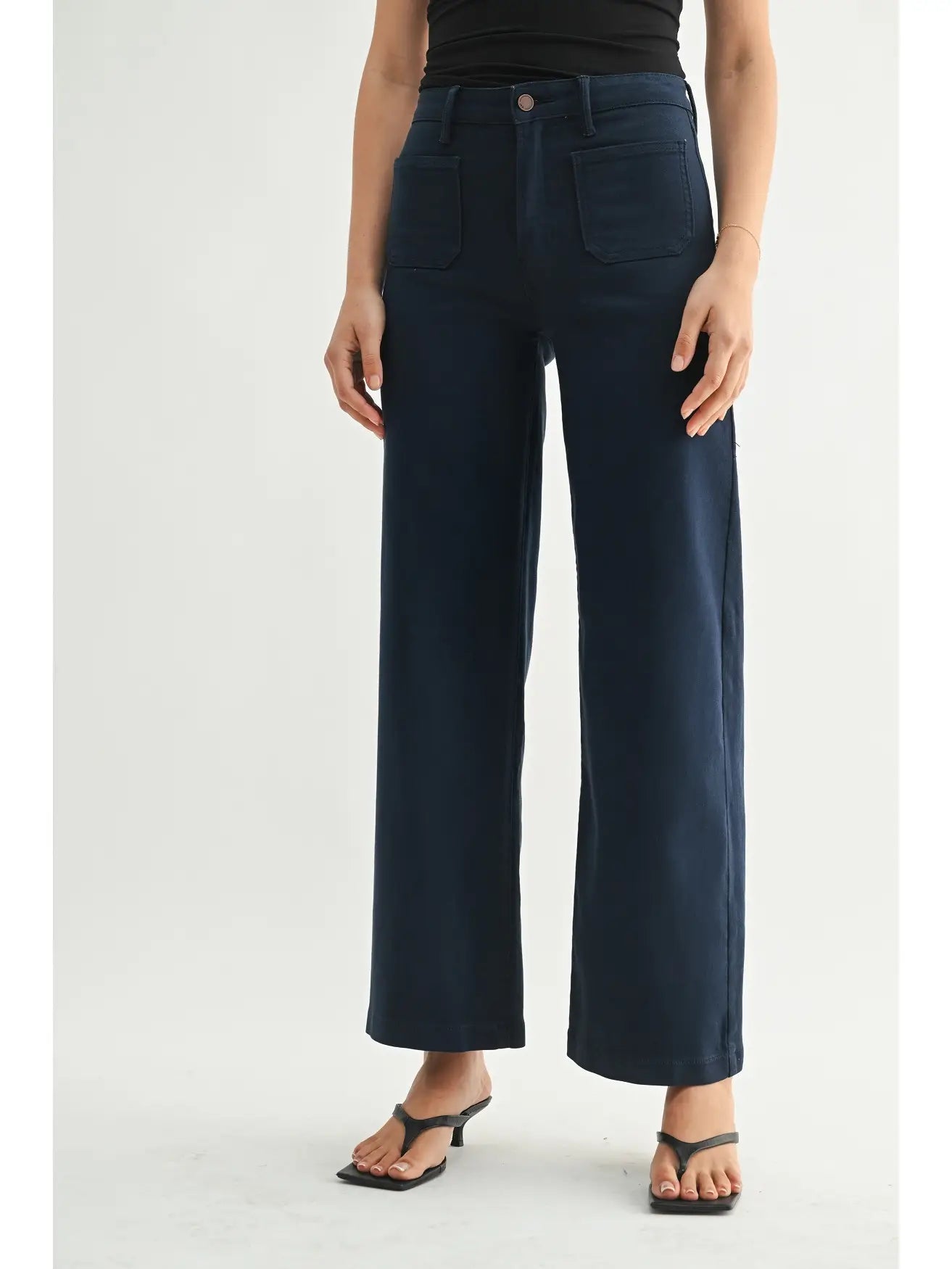 High-rise wide-leg jeans with front patch pockets and a clean cropped silhouette.