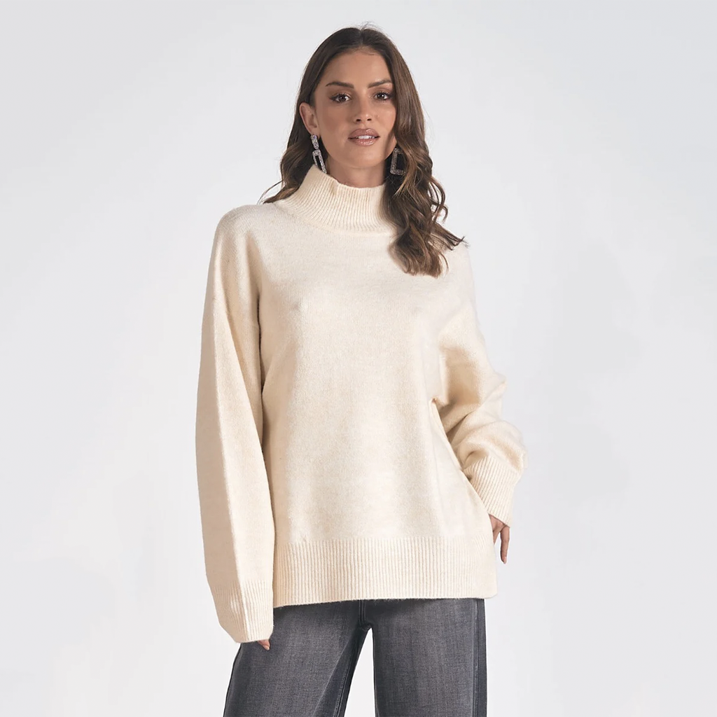 Embrace warmth and style with this sweater. Designed with a mock neck, sweater is ideal for crisp days and cozy nights out. Snuggle up with someone special and indulge in the soft comfort of this essential wardrobe favorite.