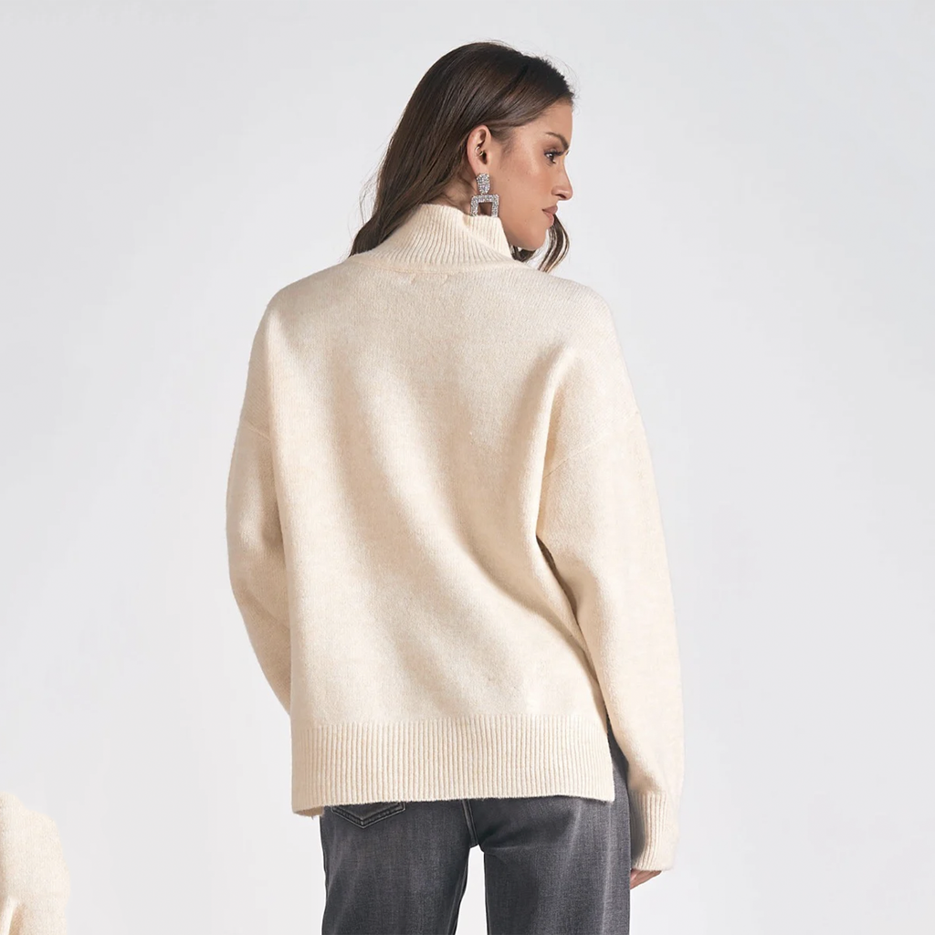 Embrace warmth and style with this sweater. Designed with a mock neck, sweater is ideal for crisp days and cozy nights out. Snuggle up with someone special and indulge in the soft comfort of this essential wardrobe favorite.