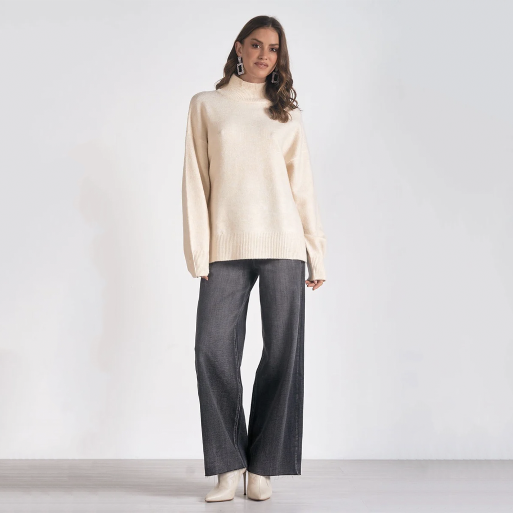 Embrace warmth and style with this sweater. Designed with a mock neck, sweater is ideal for crisp days and cozy nights out. Snuggle up with someone special and indulge in the soft comfort of this essential wardrobe favorite.