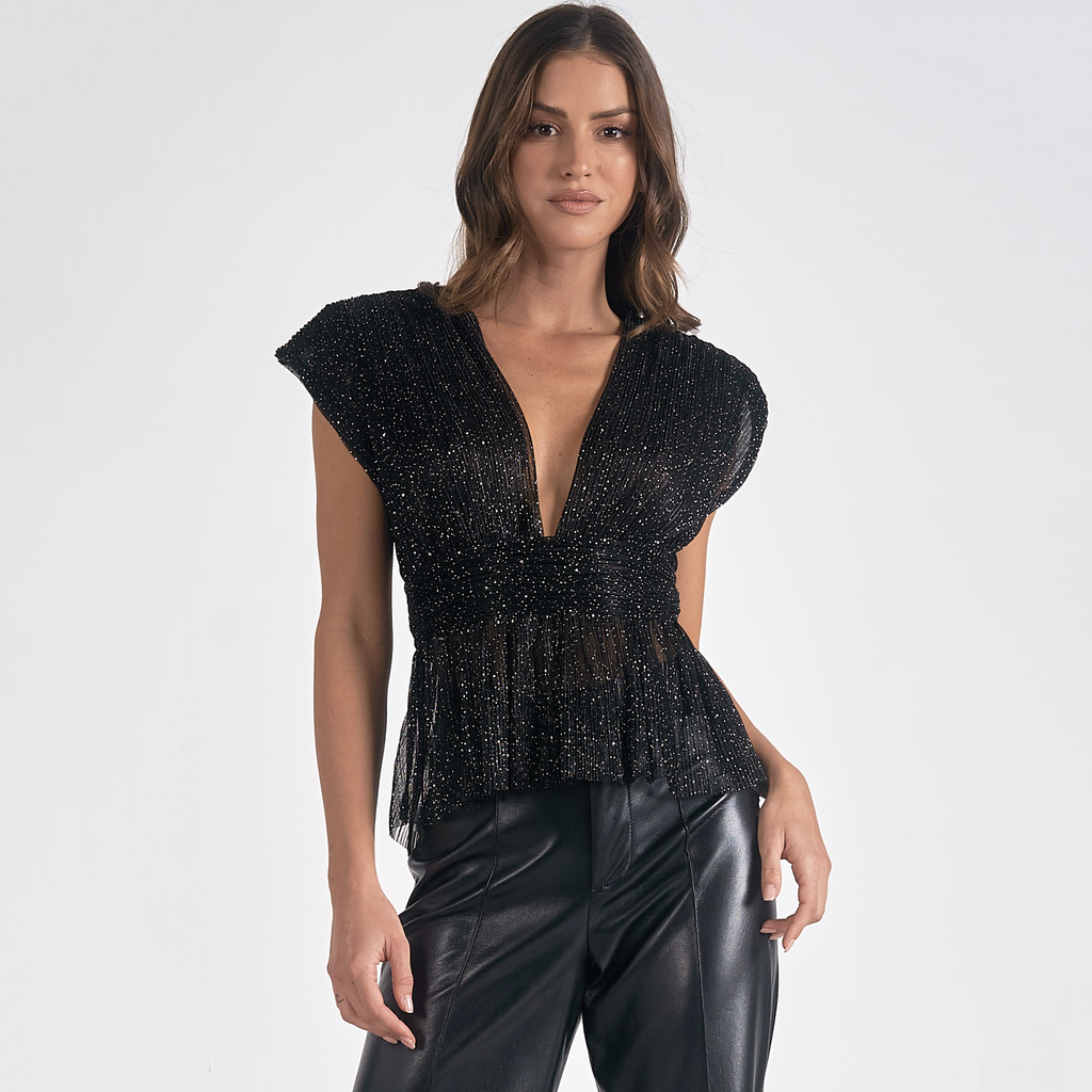 Elevate your holiday style with this top. The chic shoulder pads bring a dash of sophistication, while the wrap design accentuates your curves for a perfectly flattering fit. Ideal for any festive celebration, this sparkling top is an essential addition to your wardrobe this season.