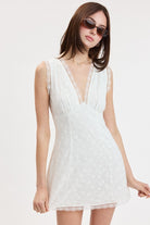 Mini dress with lace trim, V neckline, and soft silhouette