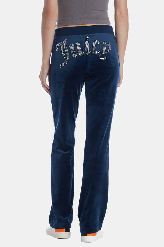 Juice Couture Velour Pant Regal Blue. For a luxury look that commands attention, these bling velour pants provide exactly what you need to stand out in style. The ribbed elastic waistband and soft stretch fabric create a cozy fit and feel for all day wear.
