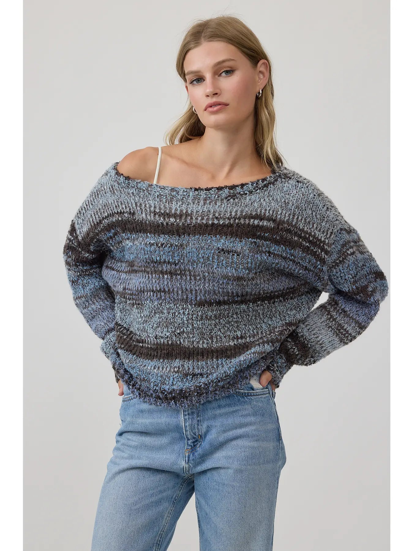Alt Text:
Relaxed striped marled knit sweater with a wide off-the-shoulder neckline and oversized fit, styled with light wash jeans.
