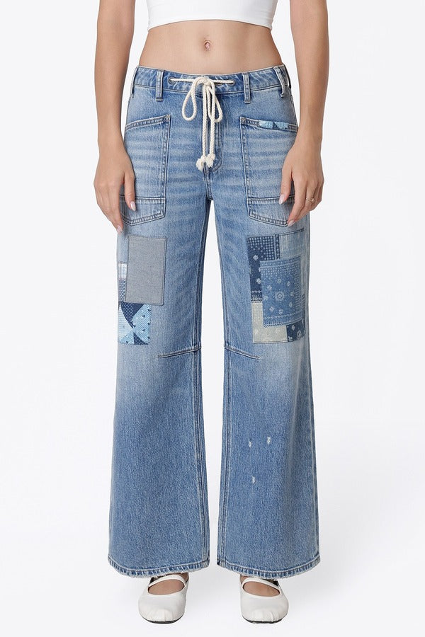 Flying Monkey High Rise Drawstring Wide Leg Drawstring in Flamenco, close-up front view of drawstring waist and patchwork