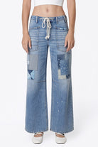 Flying Monkey High Rise Drawstring Wide Leg Drawstring in Flamenco, close-up front view of drawstring waist and patchwork