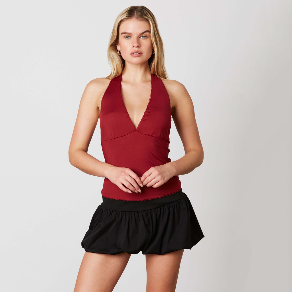 Turn heads in this flirty halter top! This halter features a sleek, slim-fitting silhouette that hugs you just right. The daring plunging neckline and bold open back add the perfect touch of drama, making it your go-to for a night out or a fun day out.