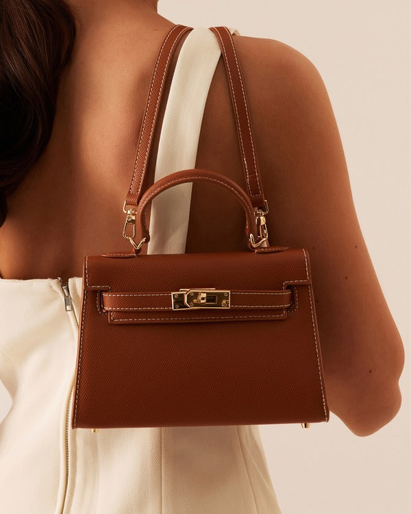 Billini Hariette Mini Handle Bag in Tan, worn on the back on model