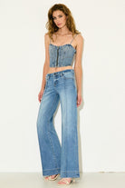 Hidden Happi Low Rise Pintuck Comfort Flare in Medium Light, styled three-quarter view