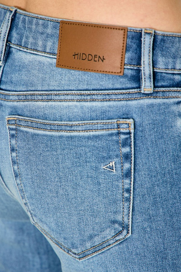 Hidden Happi Low Rise Pintuck Comfort Flare in Medium Light, detail of back pocket and logo patch