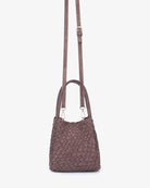 Remi & Reid Hollace Mini Tote Woven Faux Suede in Chocolate, with crossbody strap attached, front view