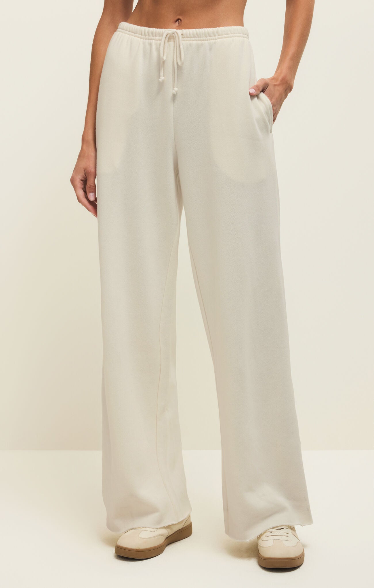 wide leg lounge pants, elevated casual pants, relaxed fit drawstring pants, effortless everyday bottoms, soft flowy lounge pants, modern relaxed trousers, casual chic wide leg pants, travel ready outfit, comfortable boutique pants, easy pull-on pants, relaxed silhouette trousers, everyday wardrobe essential, minimalist lounge style, versatile casual pants