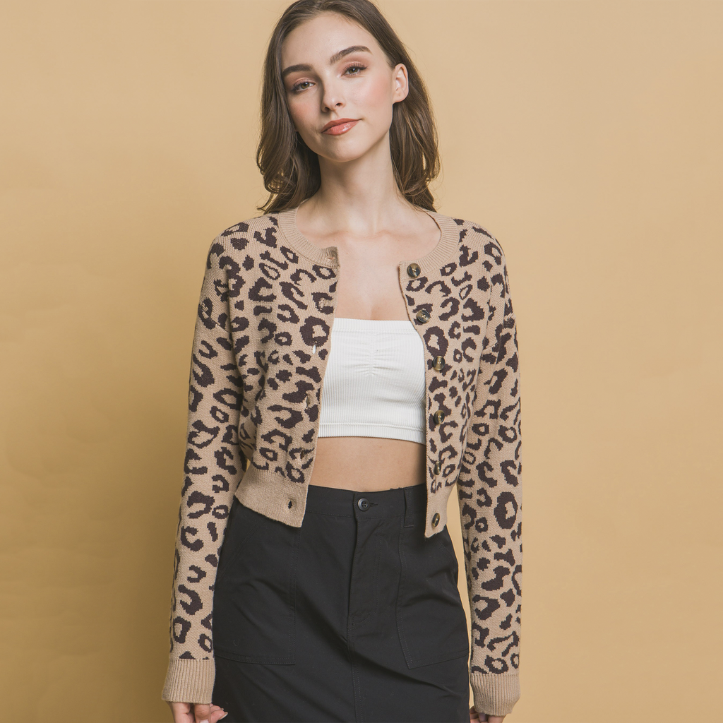 Elevate your style with the Roxanne Leopard Print Sweater! This timeless leopard print cardigan offers a classic yet modern look, complete with a buttoned closure that's perfect for layering. Its waist-length cut adds a preppy touch, making it a versatile addition to any wardrobe. Whether paired with jeans, skirts, pants, or draped over your favorite dress, this cardigan brings a polished, sophisticated finish to any outfit.