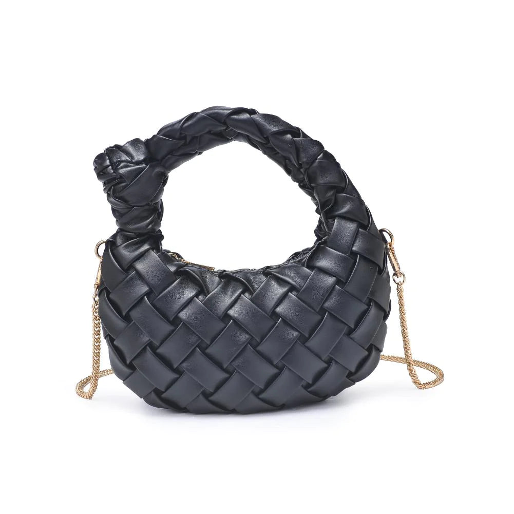 Nadia Crossbody Black. Crafted from smooth vegan leather with an intricate woven design, its knotted handle adds a touch of uniqueness. Carry it as a clutch or use the detachable chain strap for a hands-free experience, all while keeping your belongings organized in the printed fabric-lined interior with a convenient zip pocket.