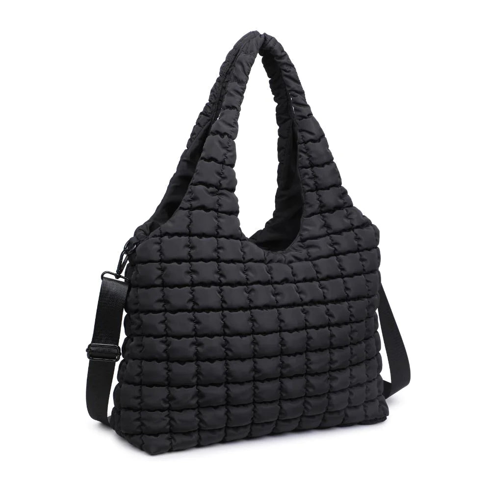Sol and Selene Elevate Bag Black. Crafted from premium nylon, this bag boasts a quilted design, offering a plush, tactile experience. Its spacious interior ensures all your essentials are stylishly stowed, making it a perfect companion for the fashionista on the go. Embrace the uplifted essence of 'Elevate' as it takes you from office to yoga with effortless elegance.