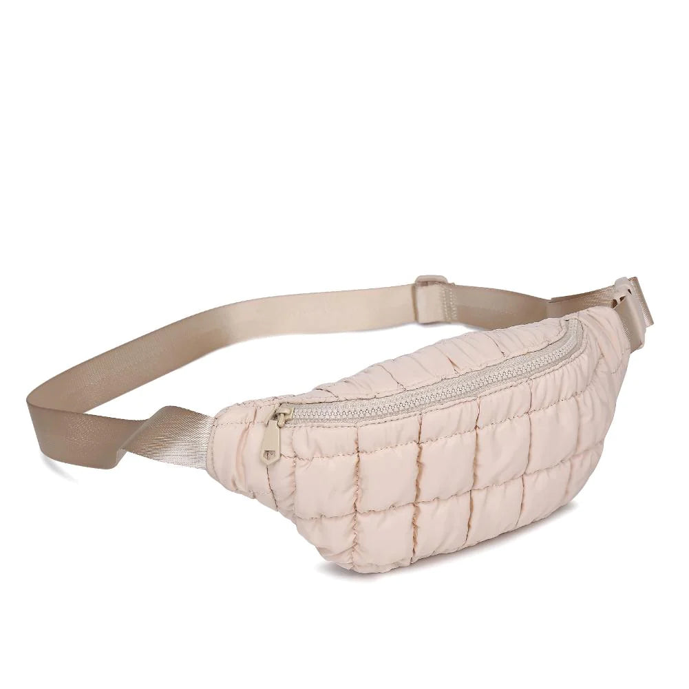 Sol & Selene Resurgence Belt Bag Cream. Embrace the bounce-back spirit with our Resurgence belt bag, featuring a quilted puff design for an on-trend, chic look, perfect for hands-free convenience while revitalizing your outfit with its unique charm and functional flair. Keep all your essentials handy and organized.