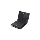 Amelie Wallet Black. The woven design and gold hardware make a fashion statement, while the snap button closure ensures your belongings stay secure. Inside, find a thoughtfully organized space with a main compartment, coin zip pocket, and eight card slots for maximum functionality.