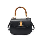 Allison Bamboo Crossbody Black. Crafted from smooth vegan leather, this bag features a sophisticated faux bamboo top handle and gold hardware for that touch of luxury. With an adjustable/detachable strap and a thoughtfully lined interior, it's not just a bag; it's a statement piece that keeps you organized on the go.