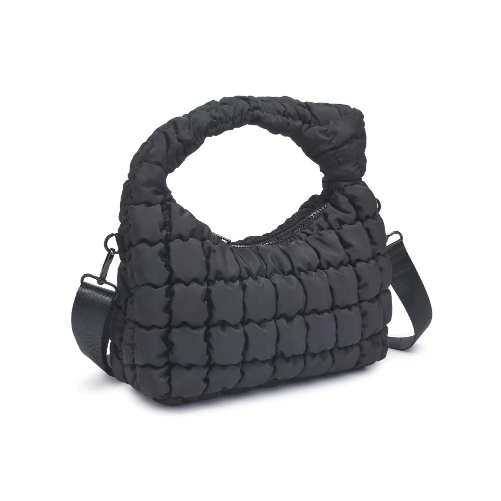 Sol & Selene Radiance Bag Black. The Radiance bag exudes a subtle elegance with its puffy quilted nylon construction, designed for the fashion-forward and wellness-minded individual. Its chic design harmonizes with a practical form, offering an uplifting accessory for everyday grace and functional flair.