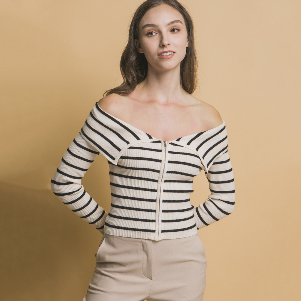 Update your wardrobe with our Off the Shoulder Striped Zip Up Long Sleeve Top. Featuring bold horizontal stripes and a flattering Bardot neckline, this top combines modern style with classic appeal.