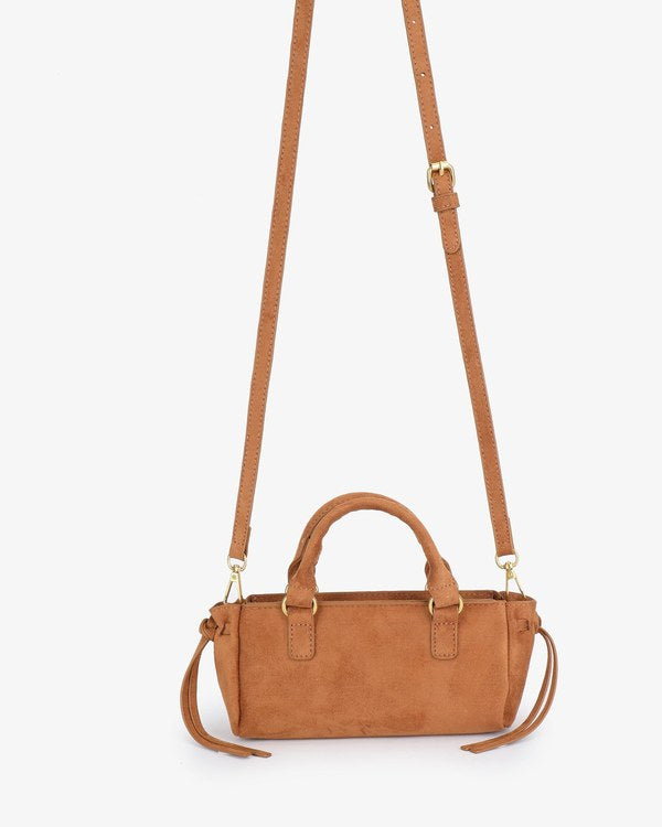 Remi & Reid Pepper Mini Satchel Faux Suede in Camel, with crossbody strap attached, front view