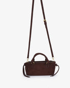 Remi & Reid Pepper Mini Satchel Faux Suede in Chocolate, with crossbody strap attached, front view