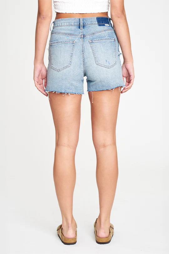 Daze Bottom Line Vintage Short Blue Wash. The Bottom Line Vintage Short is a true high rise short with vintage inspired knicks, and dimensions throughout the medium wash. It's mostly rigid denim with a little stretch, built into modern silhouettes with vintage character.