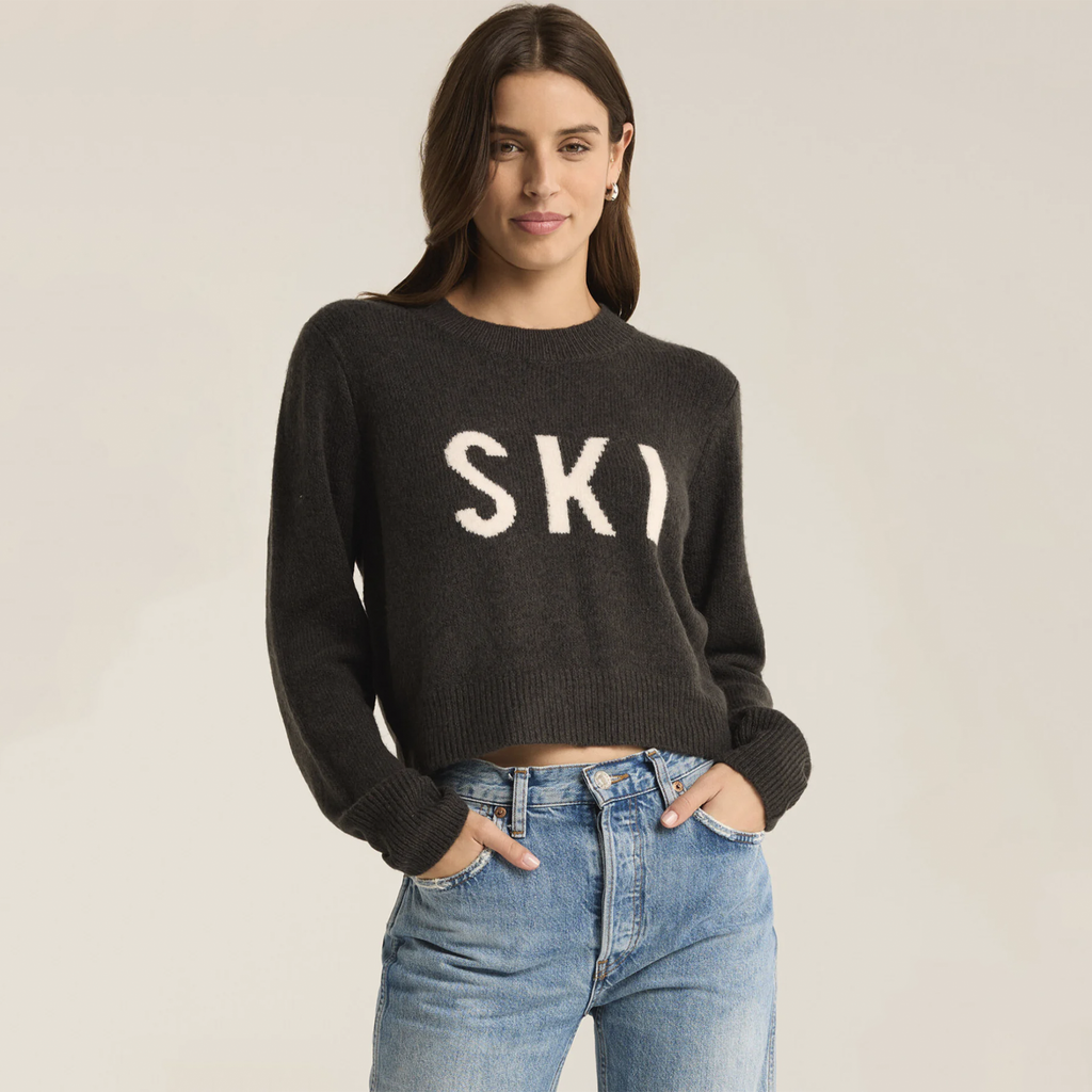 Stay cozy and stylish this winter with this plush feather yarn sweater, adorned with a fun intarsia "ski" graphic. The classic crew neck and long sleeves make it an ideal choice for après-ski gatherings or chilly winter days, adding a playful touch to your cold-weather wardrobe.