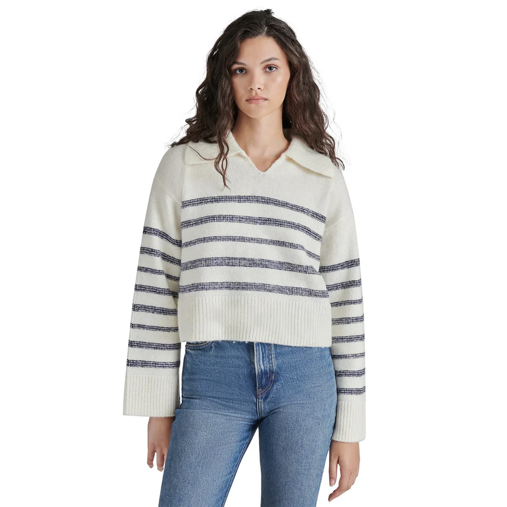 This Steve Madden collared sweater offers the perfect blend of sporty and cozy, like a rugby or polo top, but with extra warmth for the season. A must-have for effortless style and comfort.